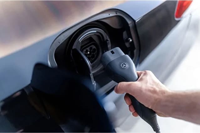 Owner plugging in a charger
